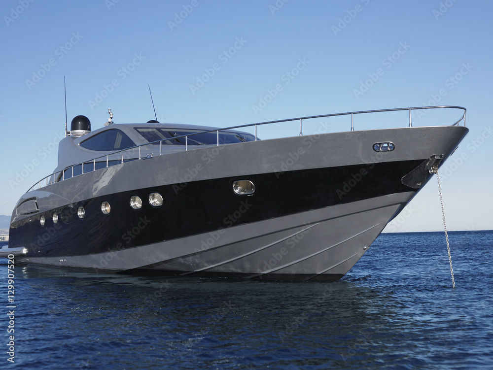 Close up of yacht moored in sea against clear blue sky