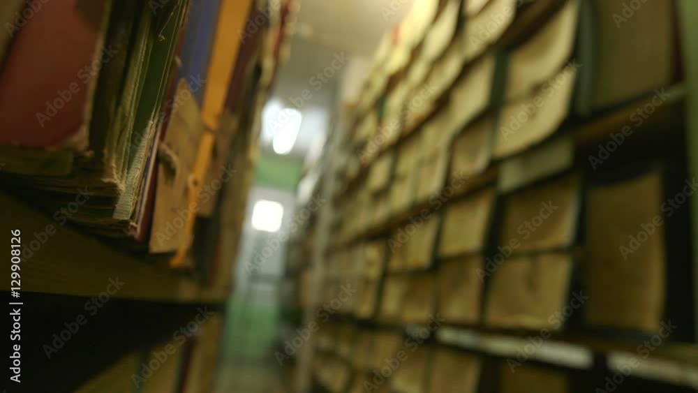 Man looking documents in the archive.