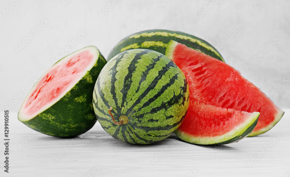 Watermelon with slices on light background Watermelon with slices on light background