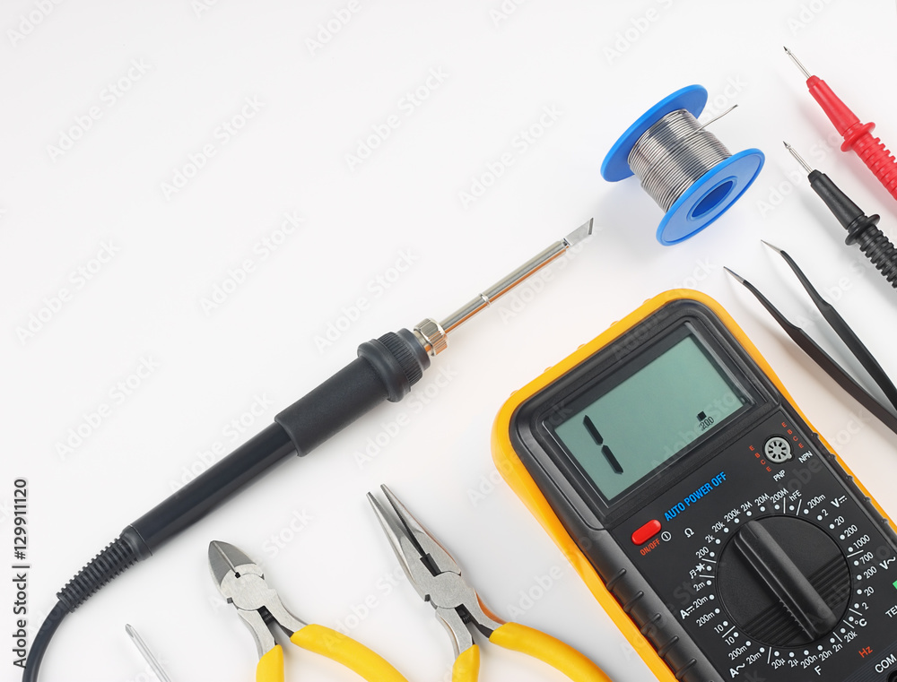 Multimeter and hand tools for electronics assembly. Objects are on a white background with shadows.
Multimeter and hand tools for electronics assembly. Objects are on a white background with shadows.