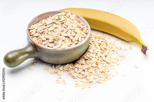 Bowl of oatmeal on white background