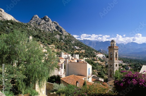 View across rooftops of the village of Lumio, Balagne, Corsica, France photo