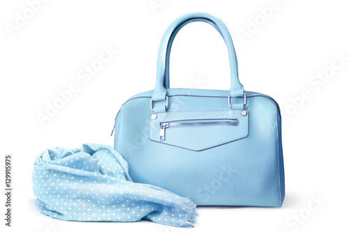 Stylish women's accessories. Beautiful set of women's handbag and scarf on a white background. Medium sky blue, pale turquoise