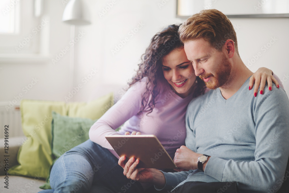 Couple hugging and smiling at home Couple hugging and smiling at home