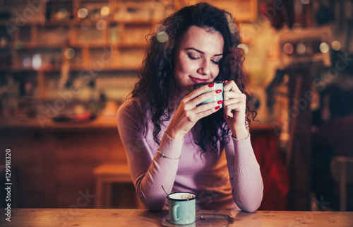 Woman enjoying aromatic coffee