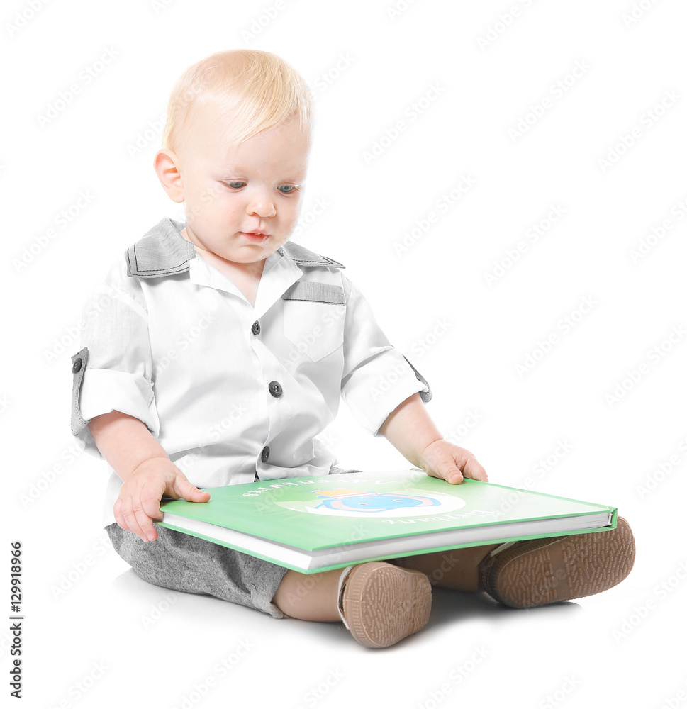 Baby boy with book sitting on white background Baby boy with book sitting on white background