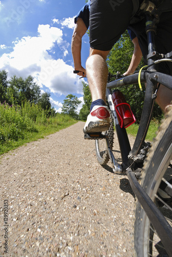 Man on bicycle low section low angle view