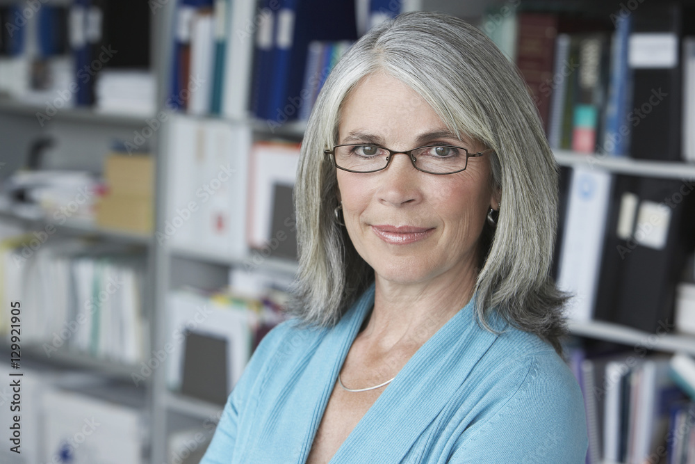 Closeup portrait of a middle aged businesswoman smiling Closeup portrait of a middle aged businesswoman smiling