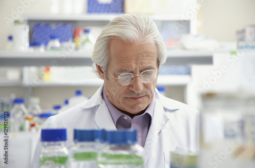 Closeup of a mature male scientist looking down in laboratory