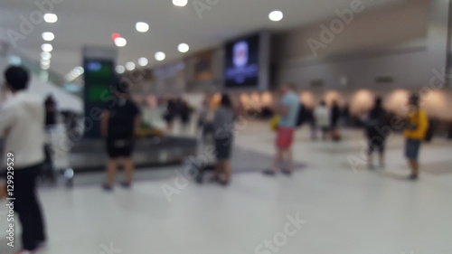 Blurry abstract Travelers waiting for their luggage at the bagga photo