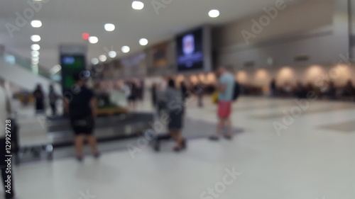 Blurry abstract Travelers waiting for their luggage at the bagga