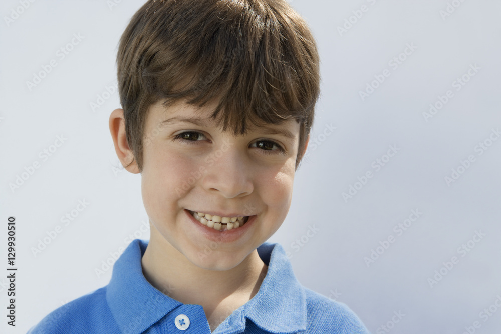 Portrait of a little boy smiling isolated over white background Portrait of a little boy smiling isolated over white background