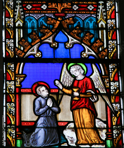 Stained Glass - Angel giving Holy Communion