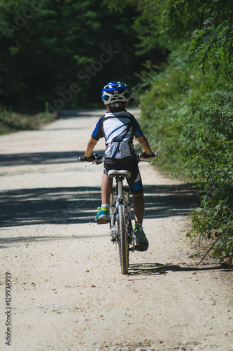 Fototapeta Naklejka Na Ścianę i Meble -  Boy mountain biking