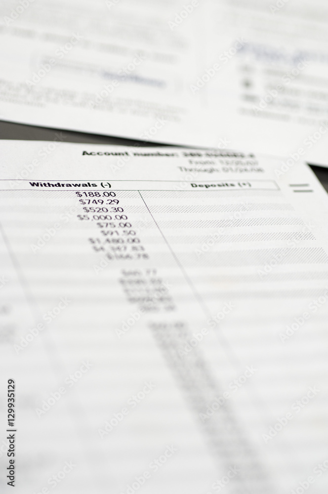 Closeup of withdrawal and deposit receipt Closeup of withdrawal and deposit receipt