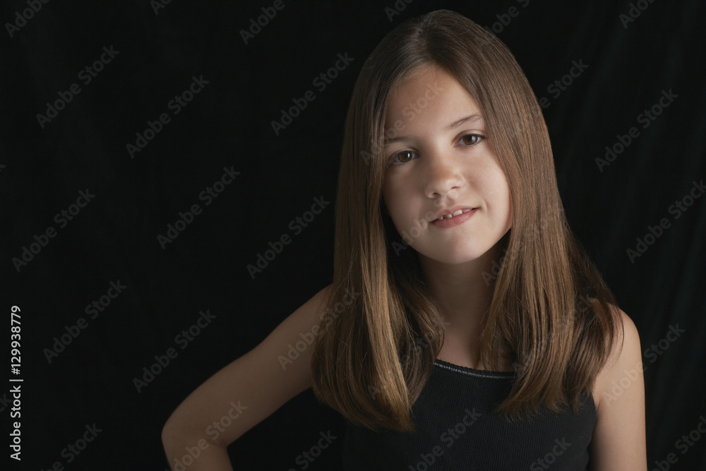 Portrait of young brunette girl against black background Portrait of young brunette girl against black background