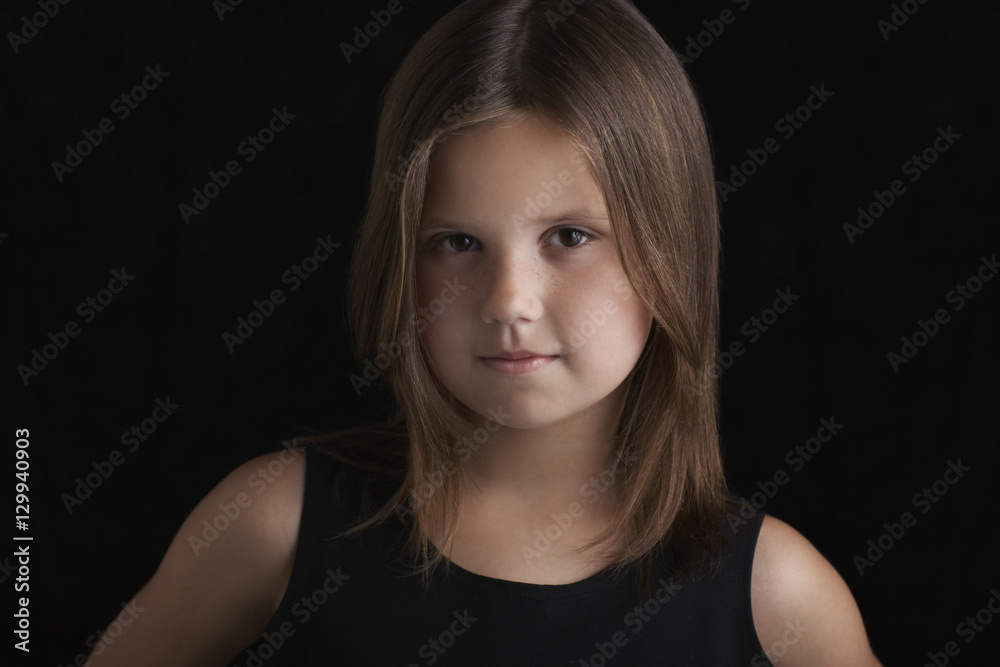 Closeup portrait of cute little girl isolated on black background Closeup portrait of cute little girl isolated on black background