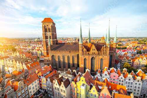Cityscape aerial view on the old town with saint Marys church on the sunset in Gdansk, Poland