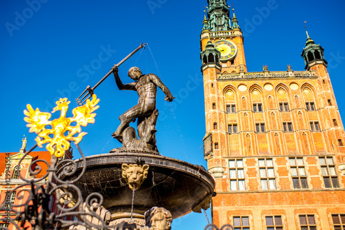 View on the town hall and famous Neptune fountain in the center of the old town of Gdansk, Poland