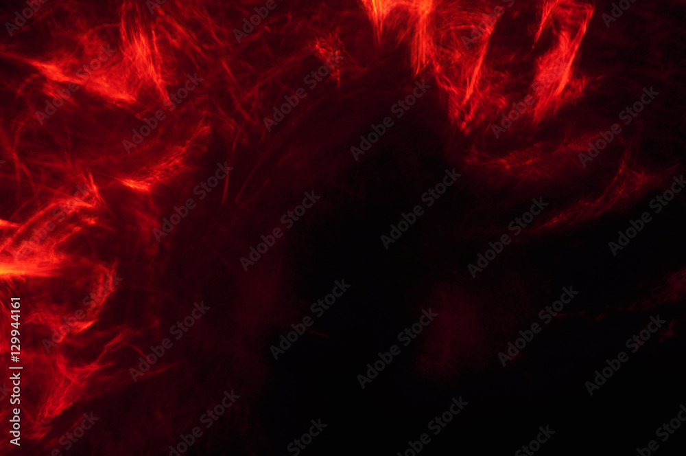 Naklejka premium Abstract composition of red smoke in the dark