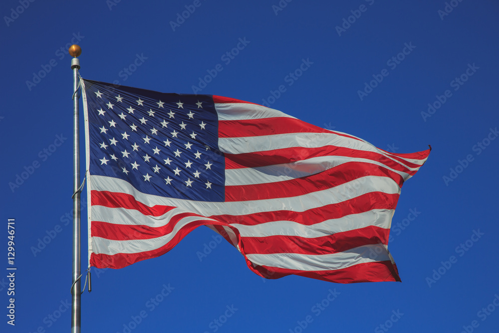 United States of America flag waving in clear sky
