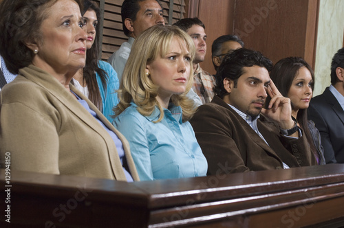 Group of jurors sitting in courtroom during trial