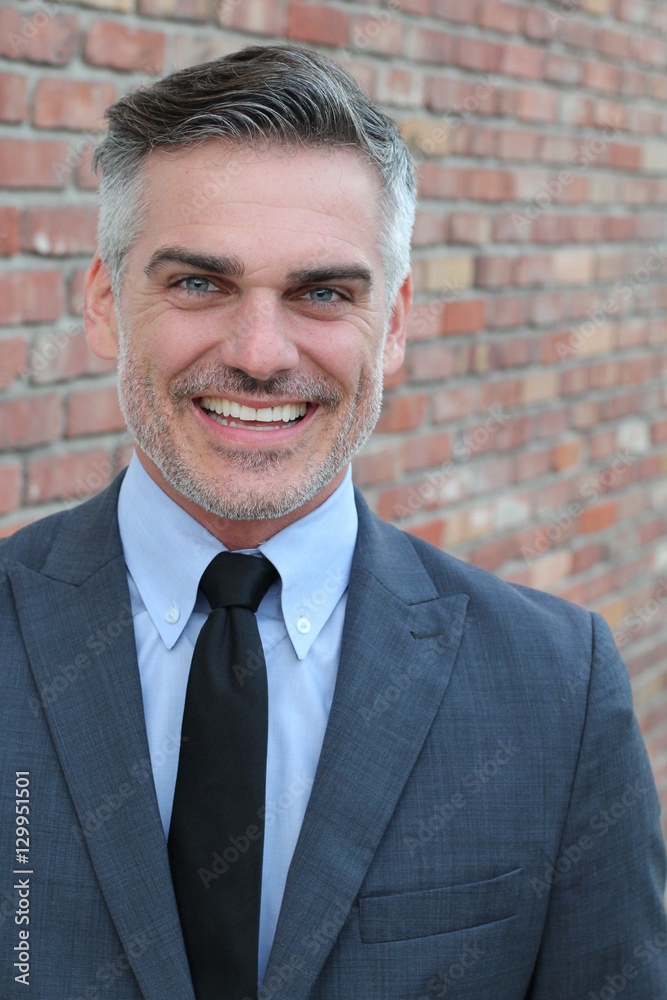 Mature businessman smiling wearing classic suit Mature businessman smiling wearing classic suit
