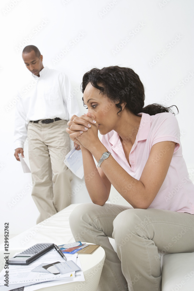 African American couple worried over credit cards expenses African American couple worried over credit cards expenses
