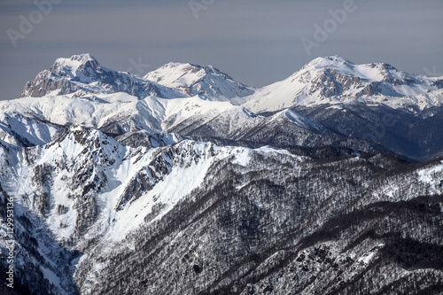 Beautiful snowy mountain peaks scenic winter landscape © Wilding