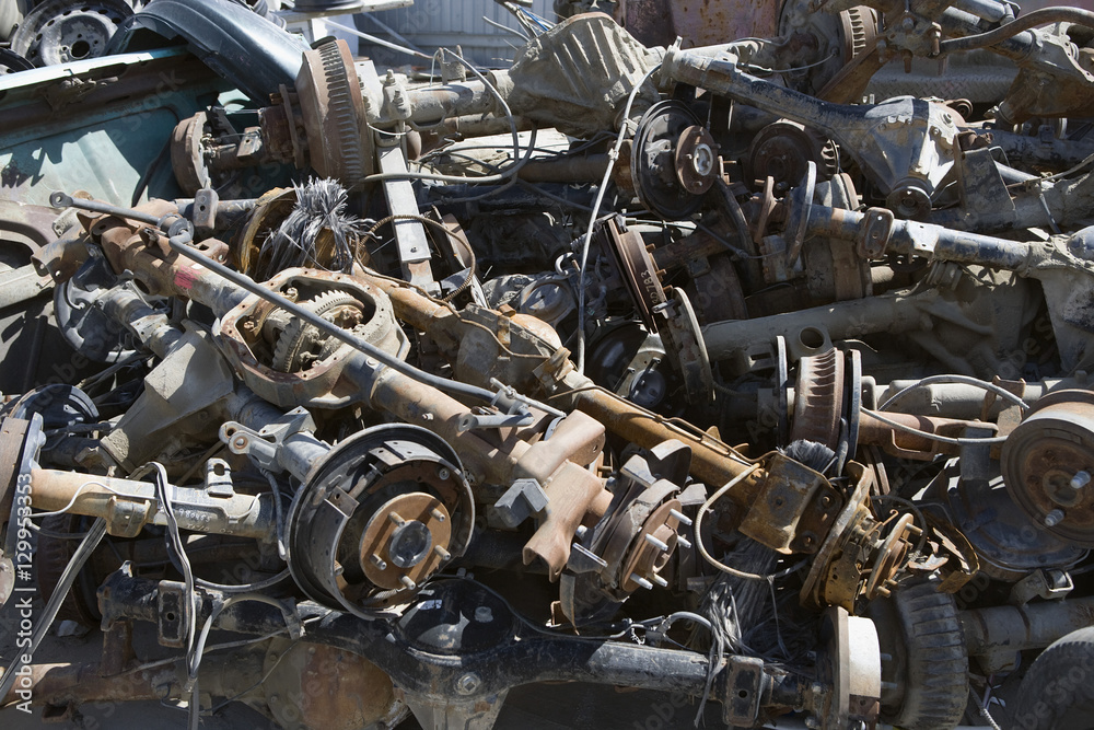 Pile of rusty car parts at junkyard