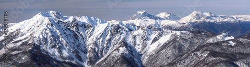 Beautiful snowy mountain peaks scenic winter panoramic landscape photo