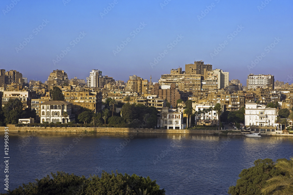 River Nile and colonial mansions in foreground Gezira island Cairo. Egypt