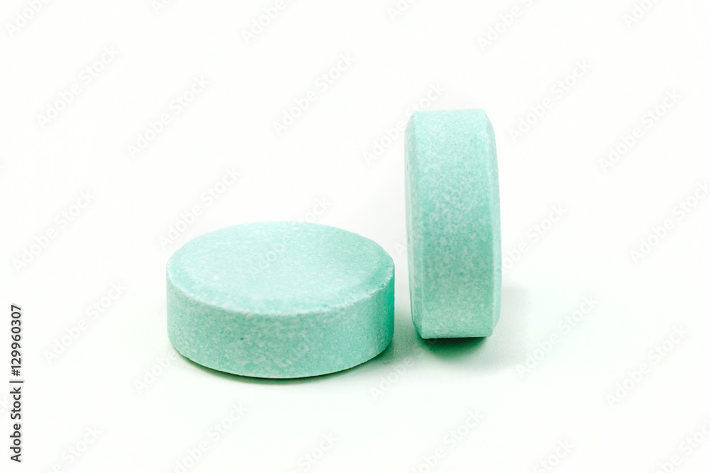 Minty antacid tablets isolated on white background Minty antacid tablets isolated on white background