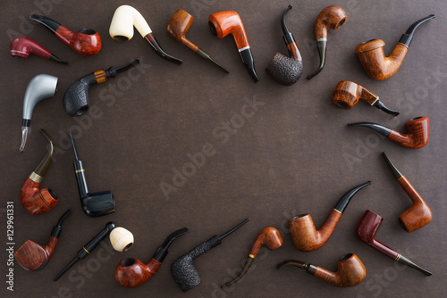 Valokuva Collection of pipes with copyspace in the middle