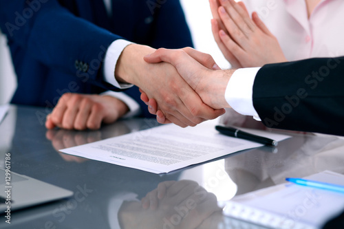 Business people shaking hands finishing up a meeting