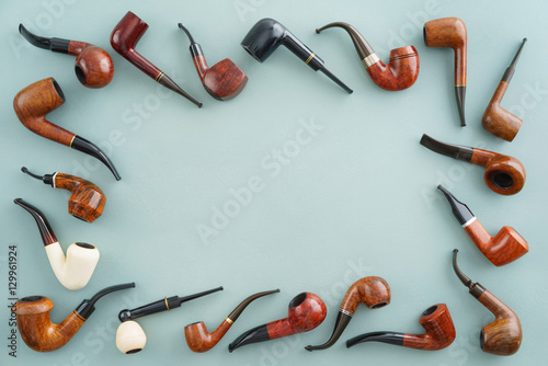 Quadro em tela Collection of pipes with copyspace in the middle