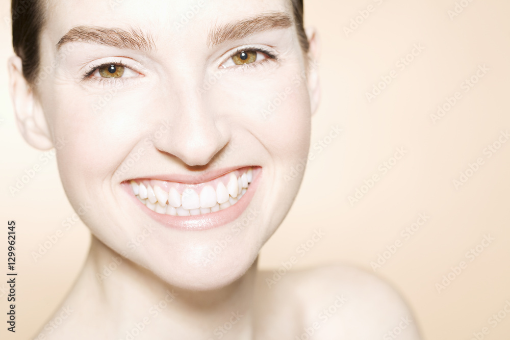 Closeup portrait of a happy beautiful young woman with clean fresh skin Closeup portrait of a happy beautiful young woman with clean fresh skin