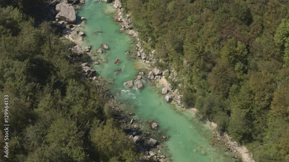AERIAL: People kayaking on whitewater rapids in Soca river on sunny summer day AERIAL: People kayaking on whitewater rapids in Soca river on sunny summer day