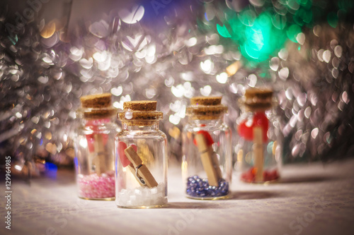 decorative bottles with little hearts on the clothespins
