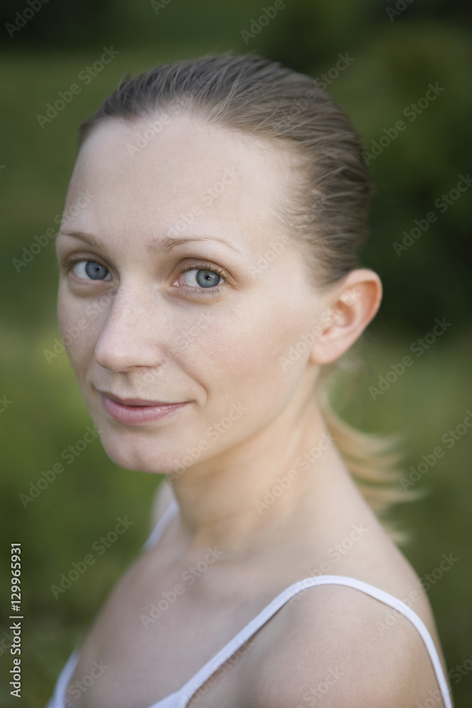 Closeup portrait of a smiling young woman outdoors Closeup portrait of a smiling young woman outdoors