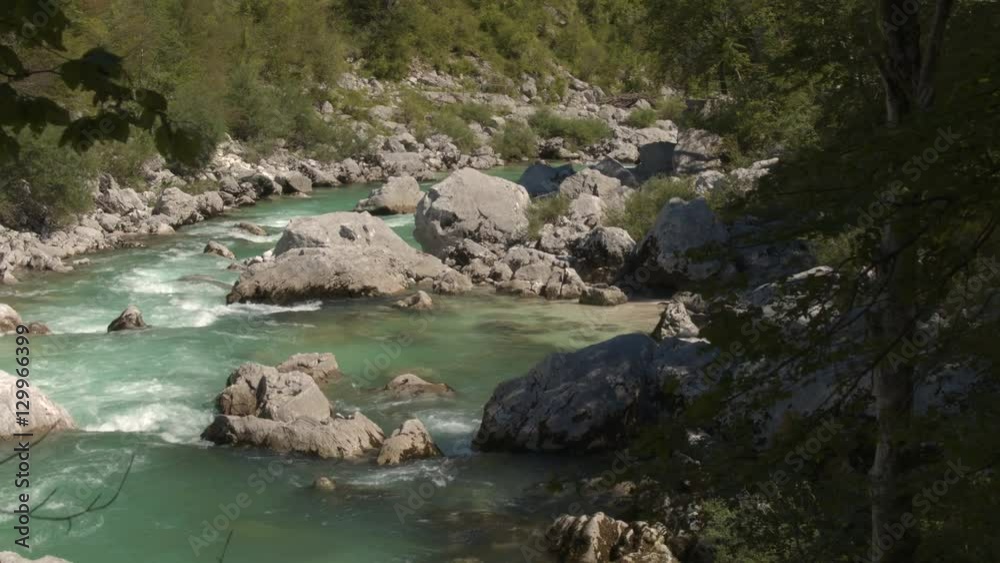 AERIAL, CLOSE UP: Beautiful emerald maintain river running between sharp rocks AERIAL, CLOSE UP: Beautiful emerald maintain river running between sharp rocks