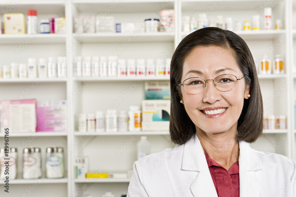 Closeup portrait of a confident smiling female pharmacist