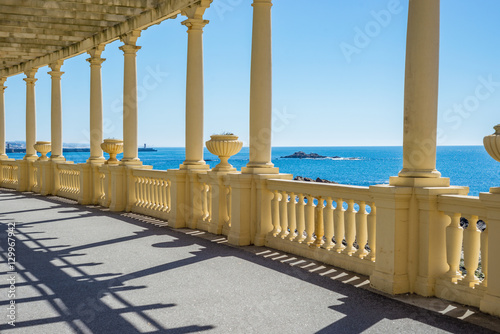 Oceanfront sea promenade pergola walkway with pillars, Foz Porto, Portugal photo