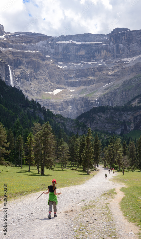 Youth hiker on the way to the cirque of Gavarnie in Pyrenees