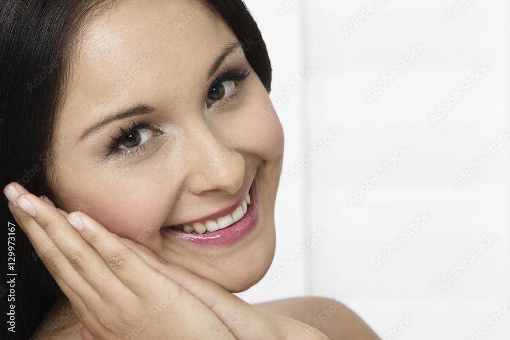 Closeup portrait of young beautiful woman smiling Closeup portrait of young beautiful woman smiling