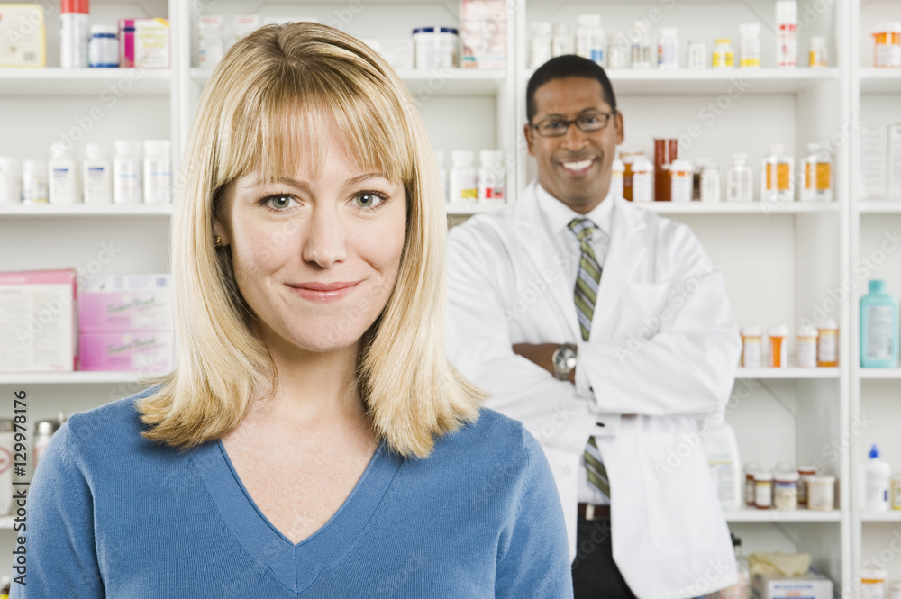 Closeup portrait of a pretty woman with pharmacist in the background
