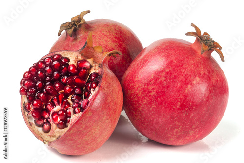three pomegranate isolated on a white background