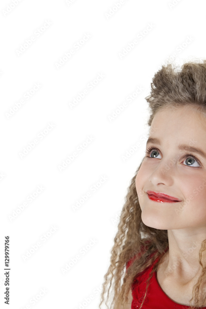 Close-up of a happy school girl looking up over white background Close-up of a happy school girl looking up over white background