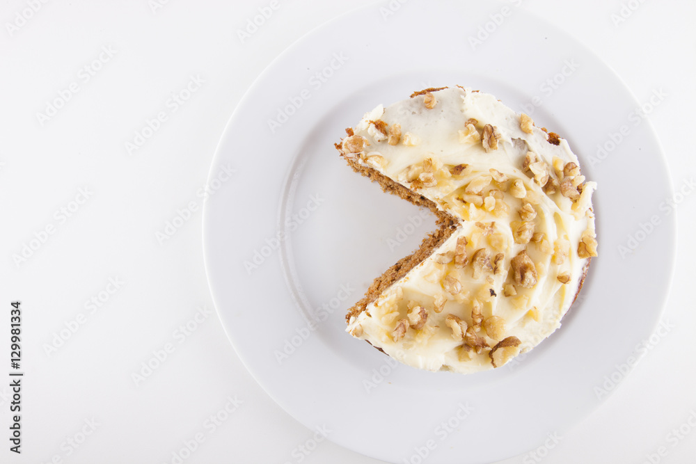 Walnut cake in plate over white background