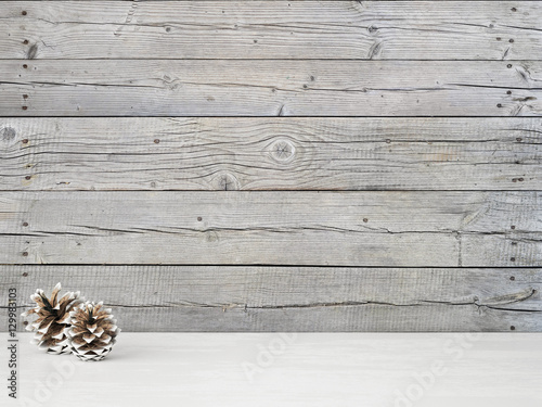 Vintage interior closeup with snowy pine cones on empty wooden wall background. 3D rendering.